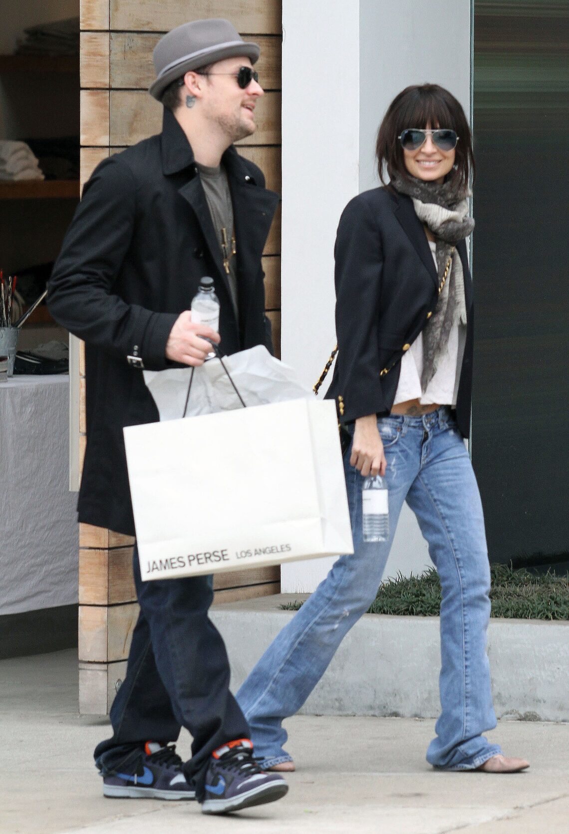 Nicole Richie sported a new dark brown 'do as she smiled at photographers while shopping with beau Joel Madden in L.A.