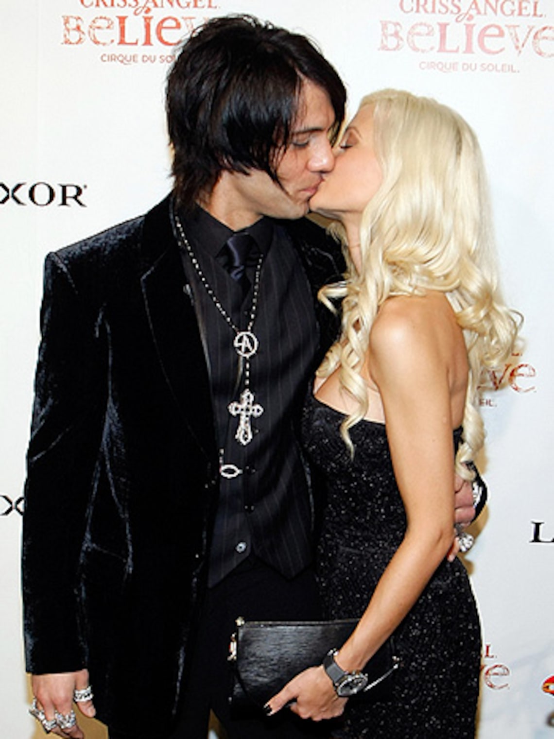 No hocus pocus! Criss Angel and Holly Madison show a little PDA for the cameras at the gala premiere of "Believe." (Getty Images for Cirque du Soleil: Ethan Miller)