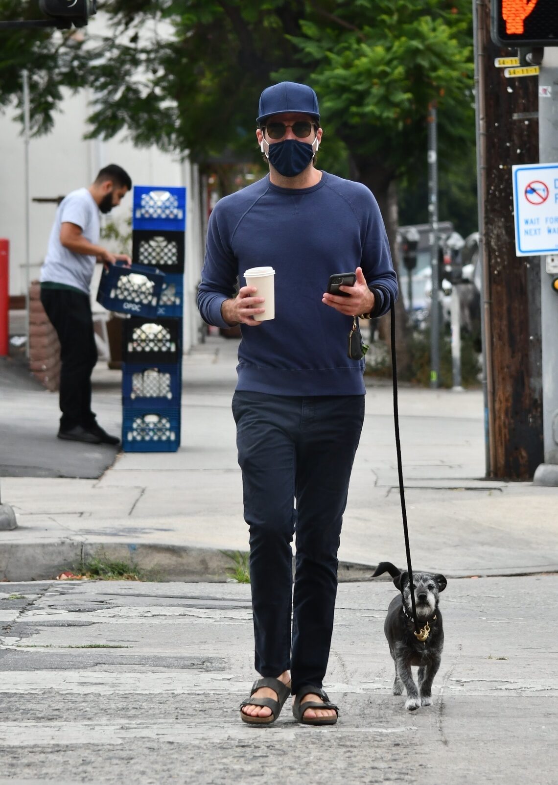 Zachary Quinto enjoyed a cup of coffee while walking his dog in Los Angeles.
