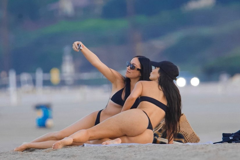 Kim Kardashian s Booty tastic Beach Day in a Thong Bikini