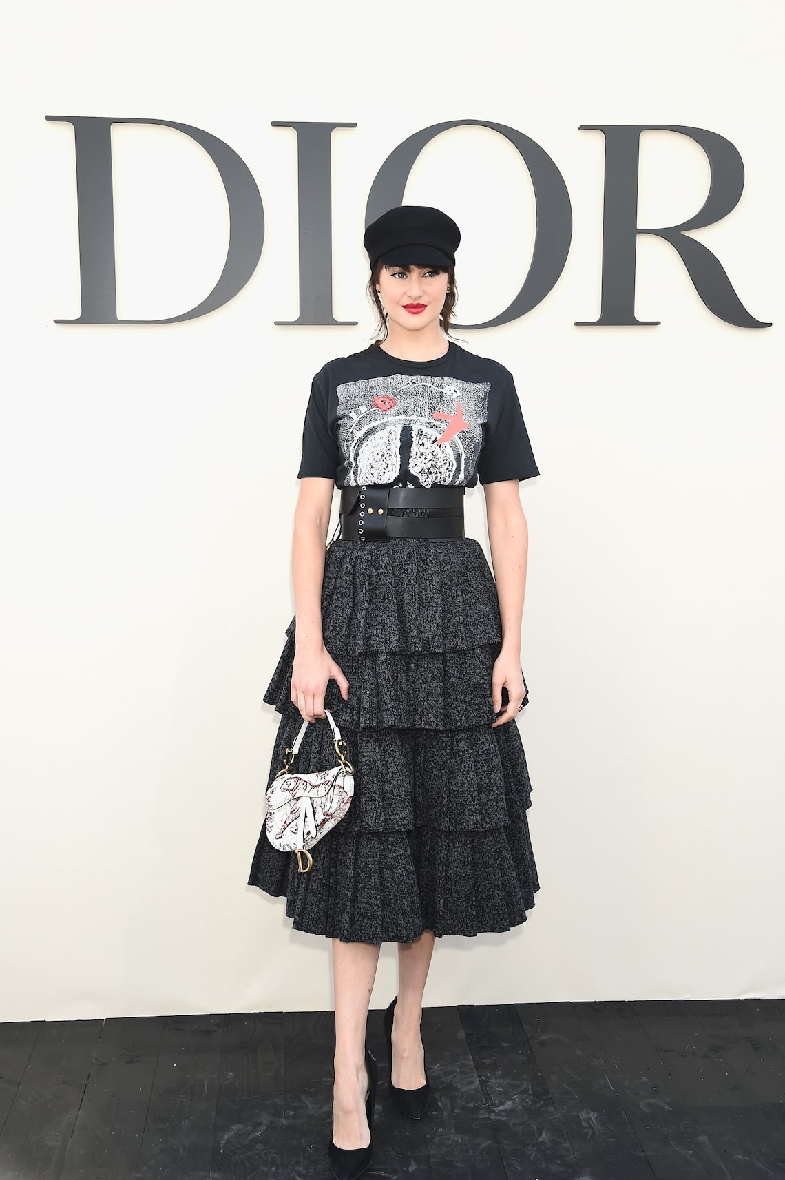 "Big Little Lies" star Shailene Woodley vamped it up with a bold red lip at the Christian Dior show.