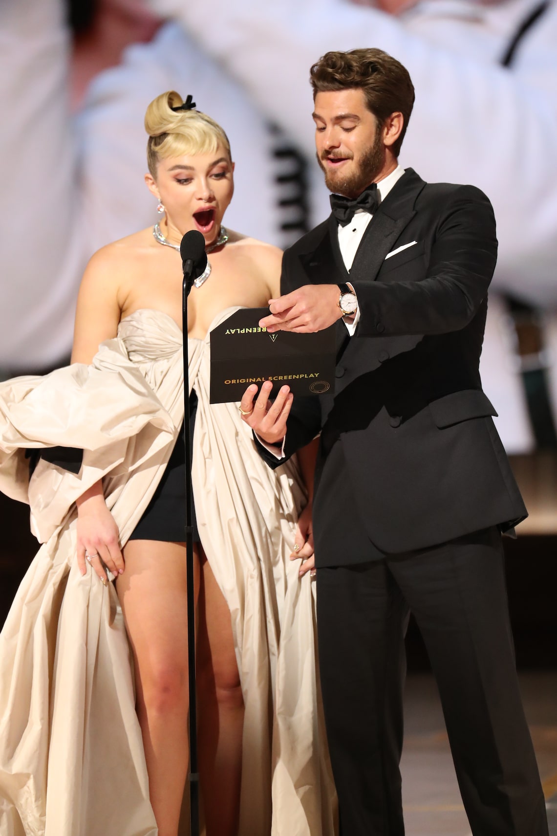 Florence Pugh and Andrew Garfield present the awards for Original Screenplay and Adapted Screenplay.