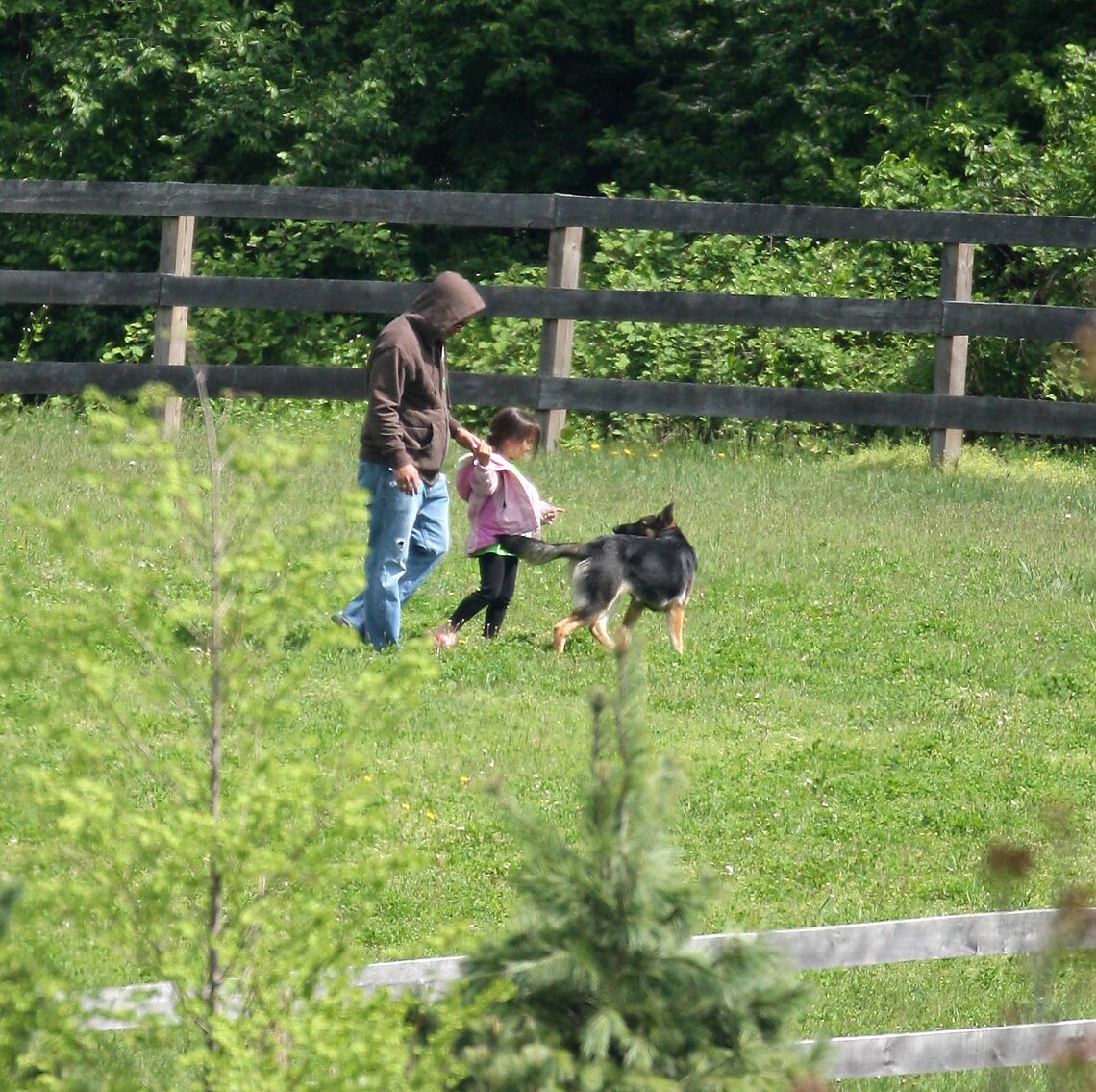 Jon Gosselin takes one of his young daughters on a walk to pick flowers near the family's home.