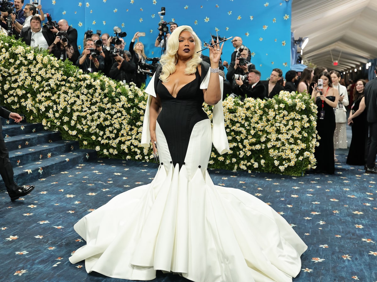lizzo silver dress Lizzo Dazzles in Silver While Posing with Her Grammy Awards!