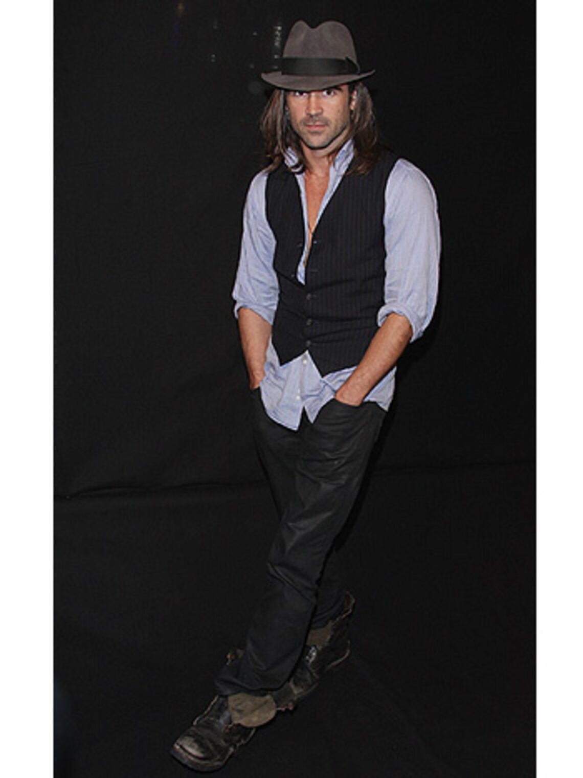 Long-haired Colin Farrell strikes a poses at a Paris photo call for his new crime-drama "Pride and Glory." (Getty Images: Francois Durand)