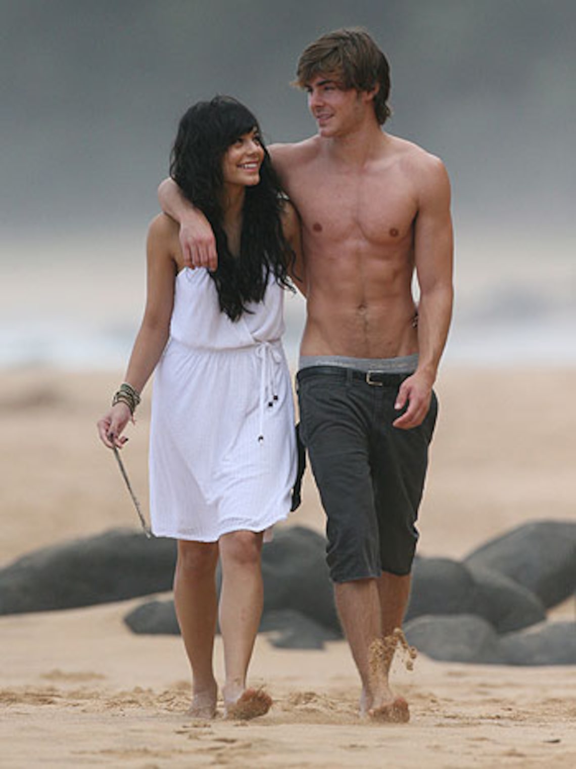 Wowza! A shirtless (and nearly pantless) Zac Efron gives GF Vanessa Hudgens a squeeze at the beach in Hawaii. The "High School Musical" twosome was in town for a friend’s wedding. (Splash News Online)