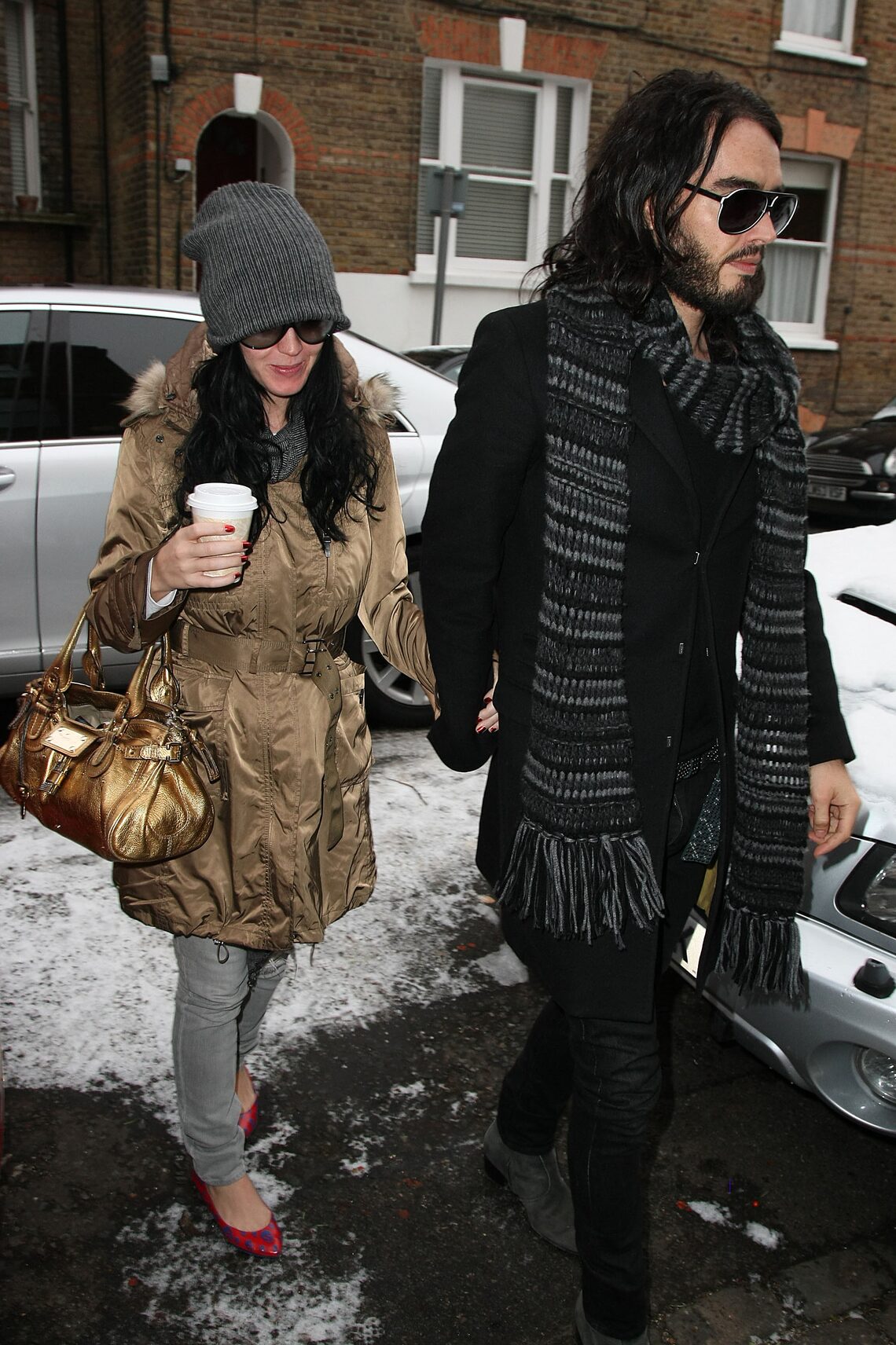 Russell Brand and Katy Perry brave the snow in England as they head out to brunch on Sunday morning.