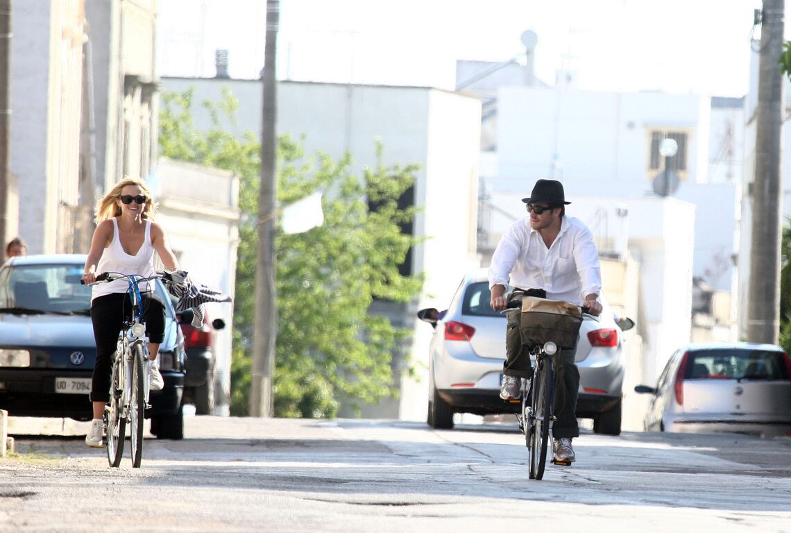 Reese Witherspoon is relaxed and happy as she and beau Jake Gyllenhaal enjoy a bike ride on the cobblestone streets of Brindisi, Italy.