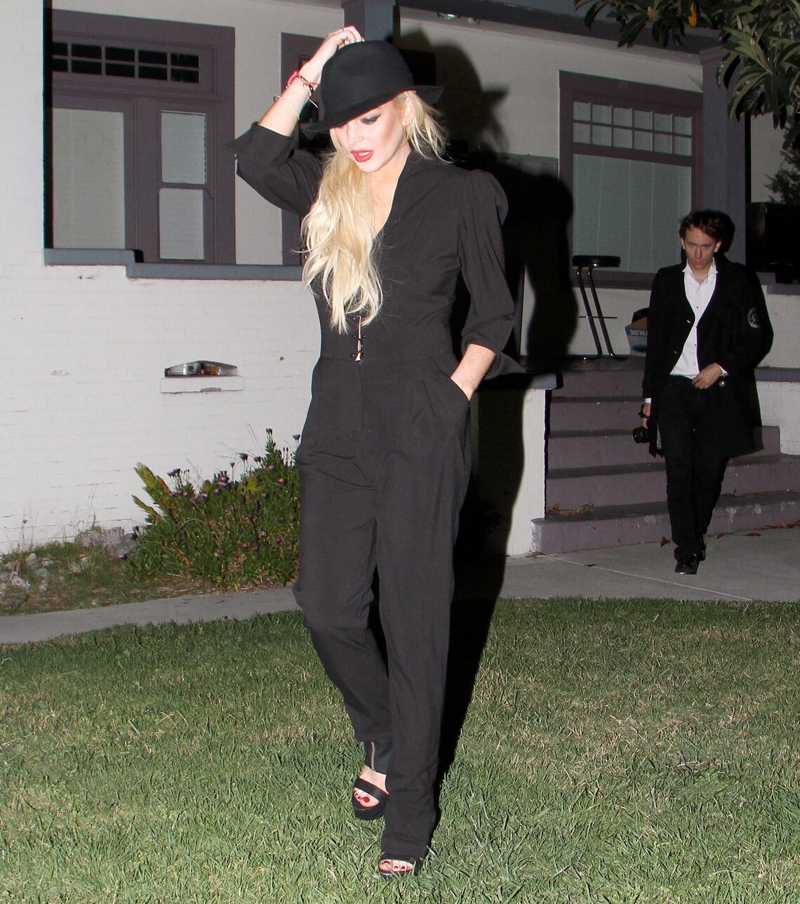 Lindsay Lohan and photographer Tyler Shields (behind Lindsay) were out in downtown L.A. together. (Photos courtesy of . For more photos of Lindsay, click here.)