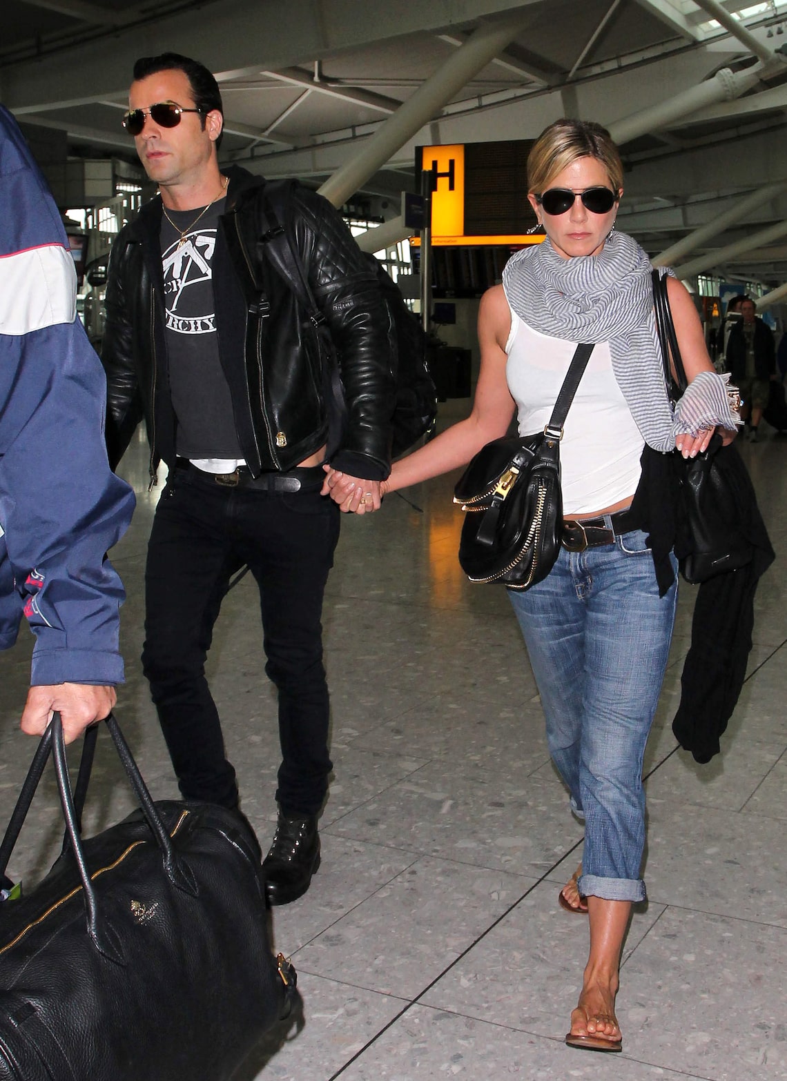 Jen and Justin departed Heathrow Airport in London after the UK premiere of "Horrible Bosses" on July 21, 2011.